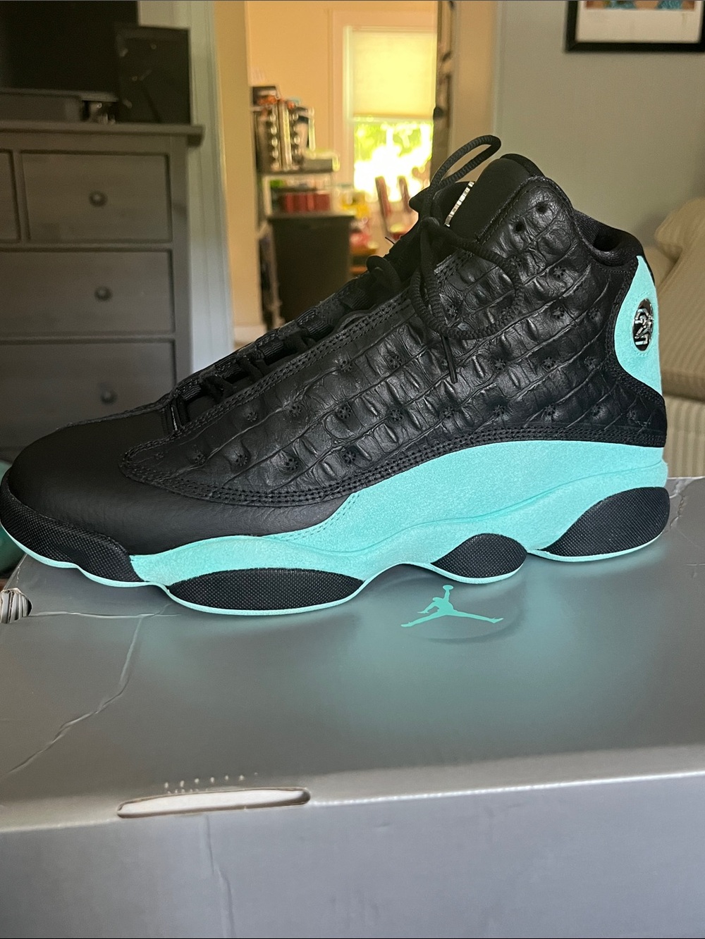 Jordan 13 Retro High-Top Sneakers in Black and island green W/ metallic emblems